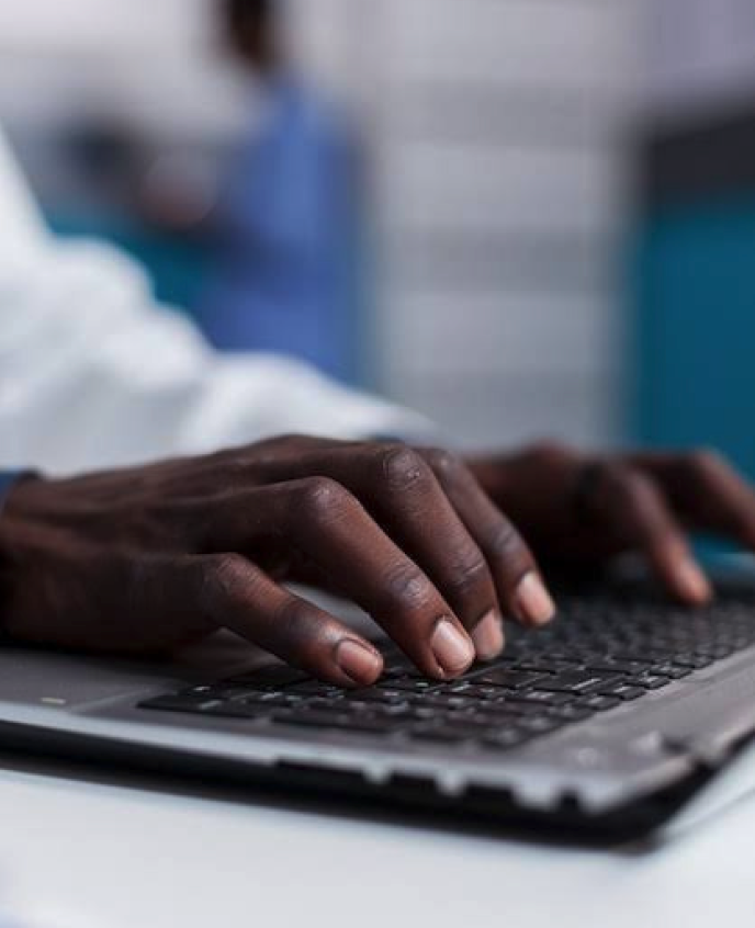 Business professional working on laptop computer in modern office